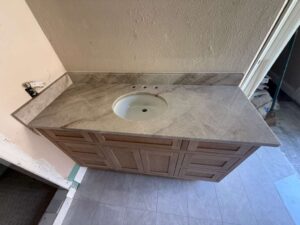 Light-toned natural stone bathroom countertop